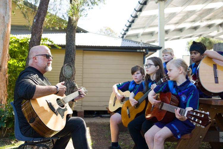 Student guitar group with tutor