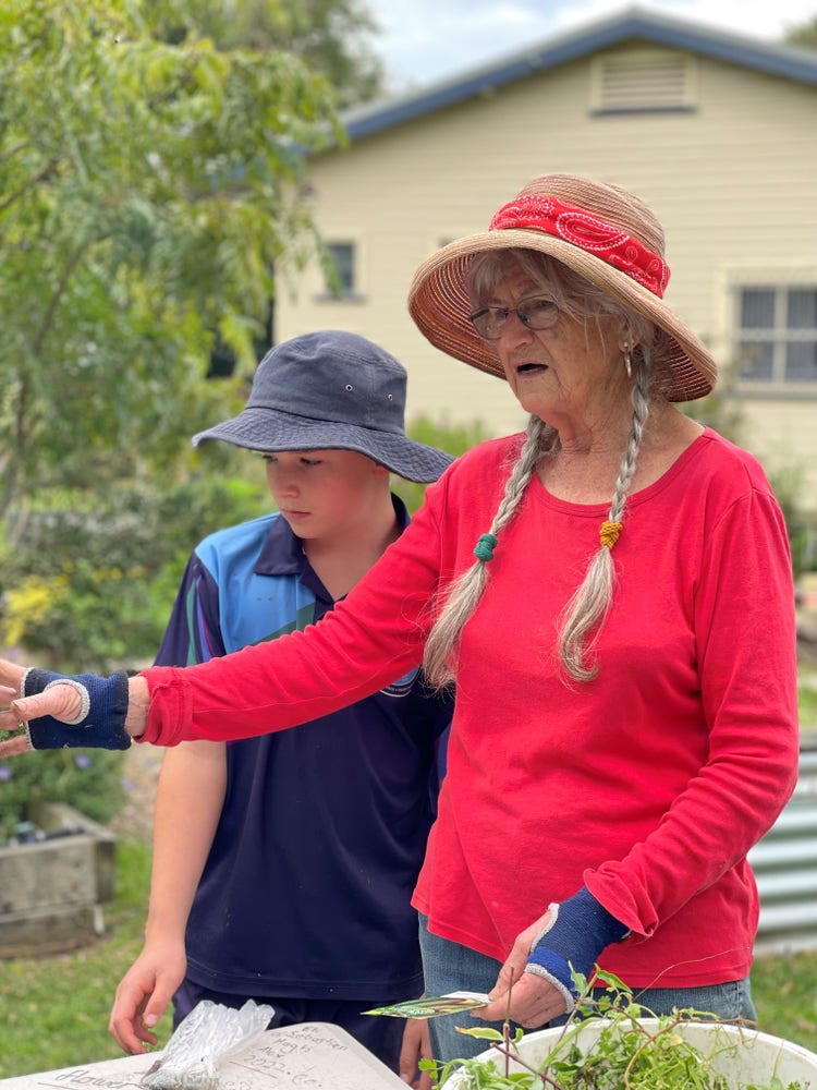 Volunteer and student in the market garden
