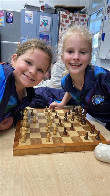 Two students playing chess